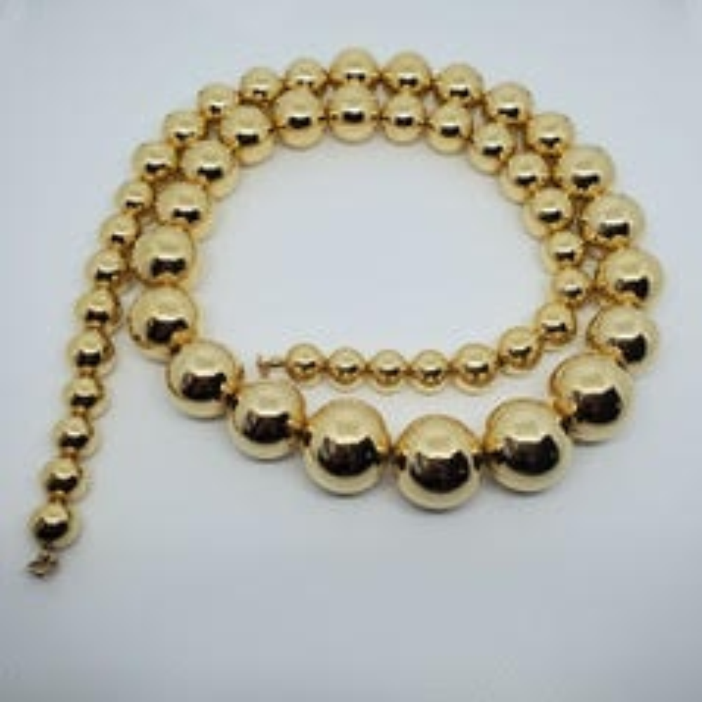 Marie Osmond Graduated Gold Bead Necklace Richards and Southern