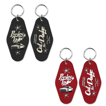 Load image into Gallery viewer, Presley &amp; Taylor Out of This Dodge Motel Room Keychain
